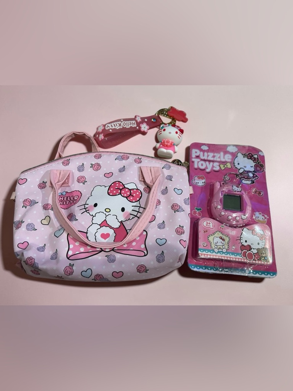 Hello Kitty Pink Floral Mini Handbag with Keychain Charm and pocket game